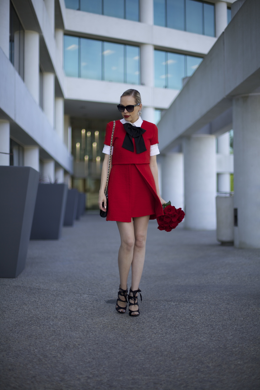 Zara red dress featured by top US fashion blog, Lombard and Fifth: image of a woman wearing a Zara red dress, J Crew white shirt, ASOS bow tie, Rebecca Minkoff bag, Benevolent Jewels earrings and DSW shoes